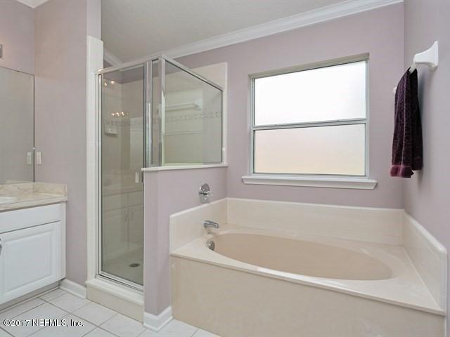 4445 Mandarin Ridge Court Jacksonville, FL 32258 - Photo 26 of 33 a white bath tub sitting next to a shower