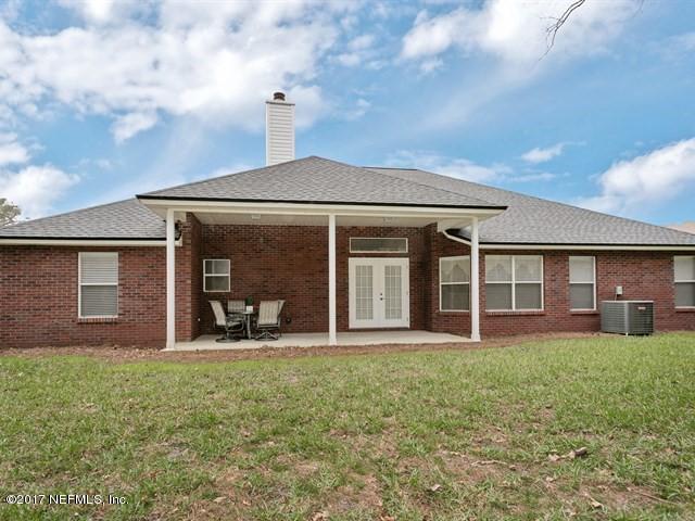 4445 Mandarin Ridge Court Jacksonville, FL 32258 - Photo 32 of 33 a front view of a house with a yard