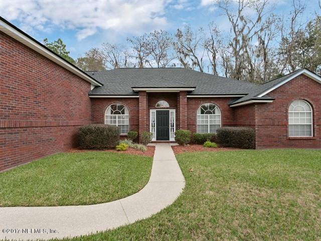 4445 Mandarin Ridge Court Jacksonville, FL 32258 - Photo 33 of 33 a view of a house with a yard patio and fire pit