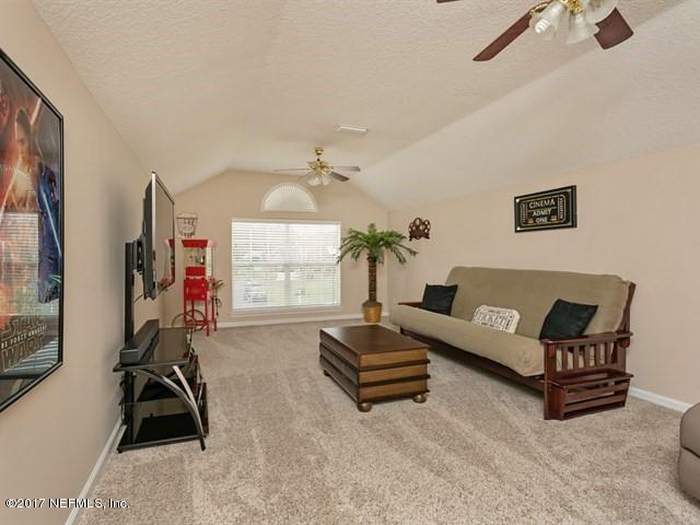 4445 Mandarin Ridge Court Jacksonville, FL 32258 - Photo 5 of 33 a living room with furniture a air conditioner and a window