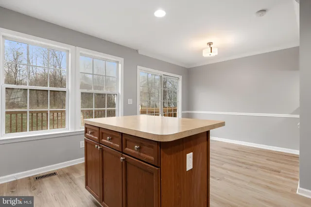 a kitchen with a sink and a window