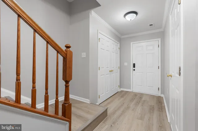 a view of an entryway with wooden floor