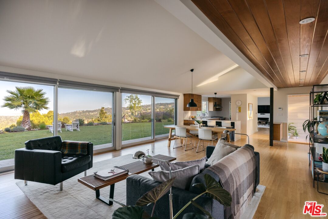 31 Silver Spring Drive Rolling Hills Estates, CA 90274 - Photo 18 of 46 a living room with furniture and a floor to ceiling window