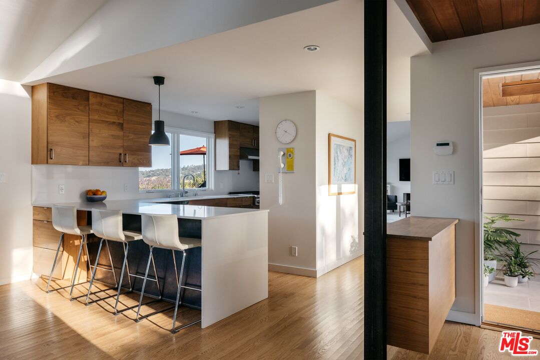 31 Silver Spring Drive Rolling Hills Estates, CA 90274 - Photo 21 of 46 a open kitchen with stainless steel appliances kitchen island granite countertop a refrigerator a stove top oven a sink and dishwasher