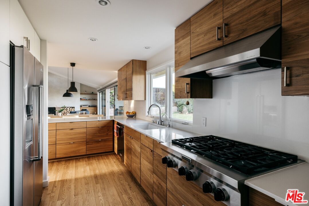31 Silver Spring Drive Rolling Hills Estates, CA 90274 - Photo 25 of 46 a kitchen with stainless steel appliances a stove a sink and a refrigerator