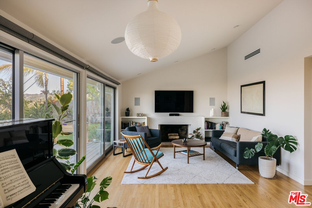 31 Silver Spring Drive Rolling Hills Estates, CA 90274 - Photo 26 of 46 a living room with furniture a flat screen tv and a large window
