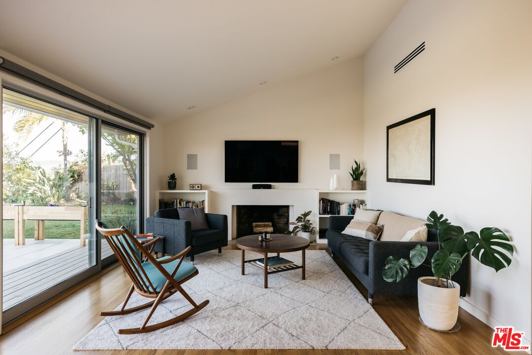 31 Silver Spring Drive Rolling Hills Estates, CA 90274 - Photo 28 of 46 a living room with furniture a flat screen tv and a floor to ceiling window