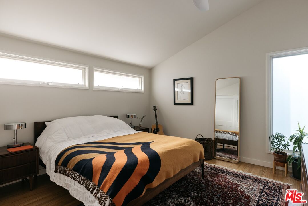 31 Silver Spring Drive Rolling Hills Estates, CA 90274 - Photo 30 of 46 a bedroom with a bed and a potted plant