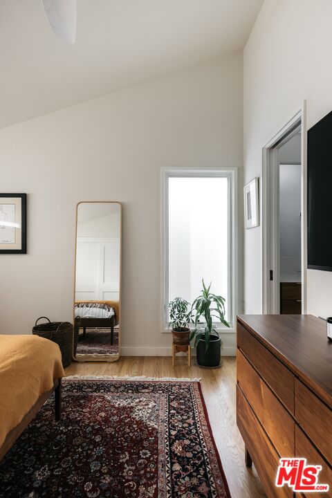 31 Silver Spring Drive Rolling Hills Estates, CA 90274 - Photo 32 of 46 a bedroom with a bed and a potted plant