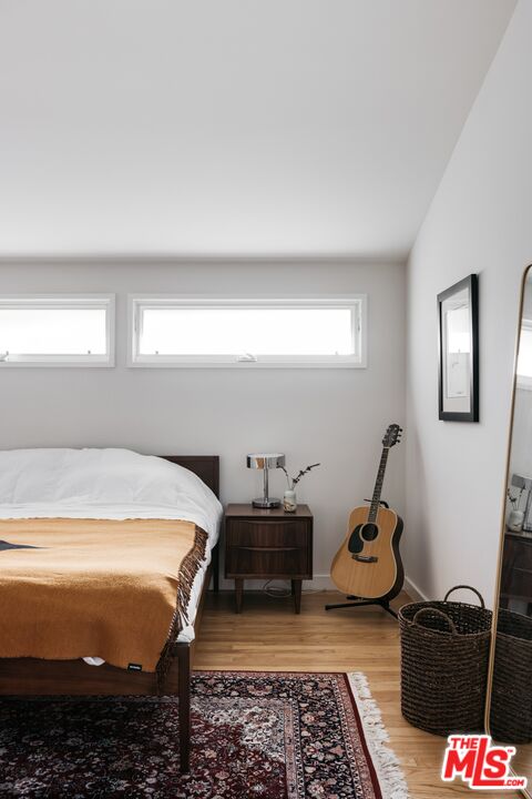 31 Silver Spring Drive Rolling Hills Estates, CA 90274 - Photo 33 of 46 a bedroom with a bed and wooden floor