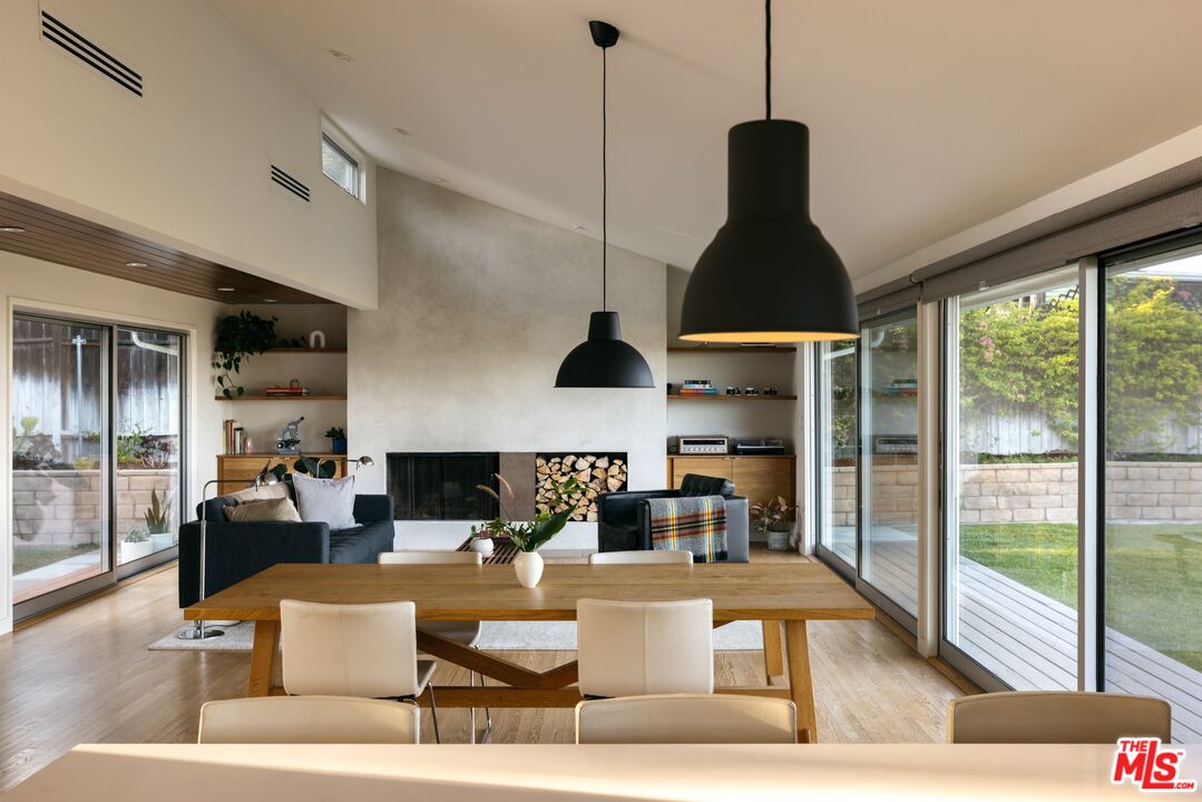 31 Silver Spring Drive Rolling Hills Estates, CA 90274 - Photo 6 of 46 a living room with furniture a lamp and a floor to ceiling window