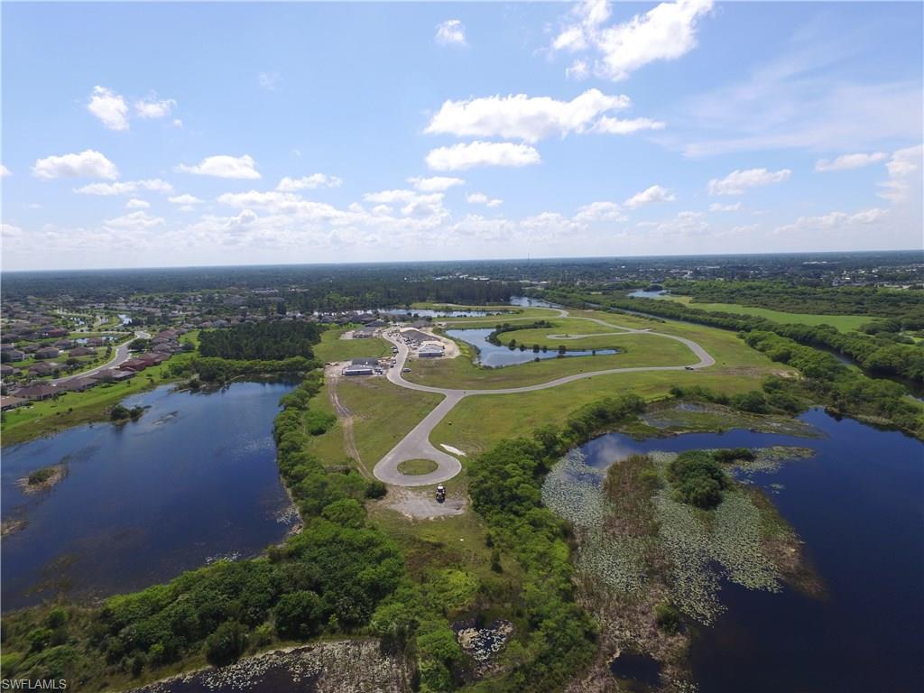 8137 Gopher Tortoise Trail Lehigh Acres, FL 33972 - Photo 15 of 21 an aerial view of lake residential houses with outdoor space and swimming pool