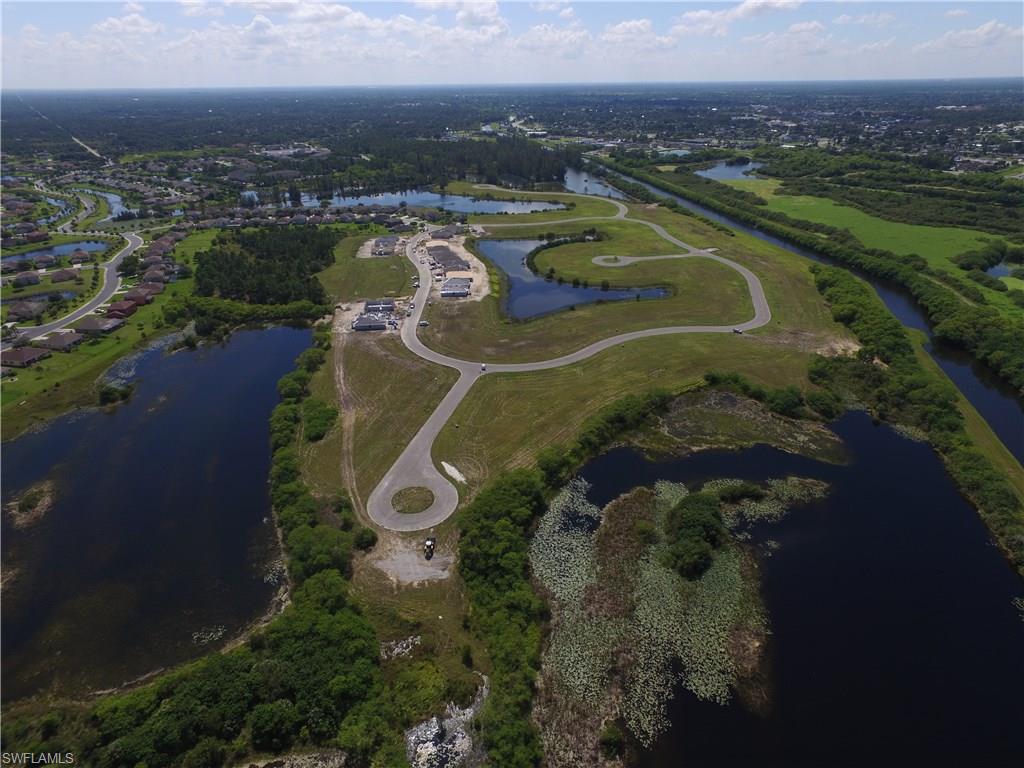 8137 Gopher Tortoise Trail Lehigh Acres, FL 33972 - Photo 19 of 21 an aerial view of lake residential house with outdoor space and river