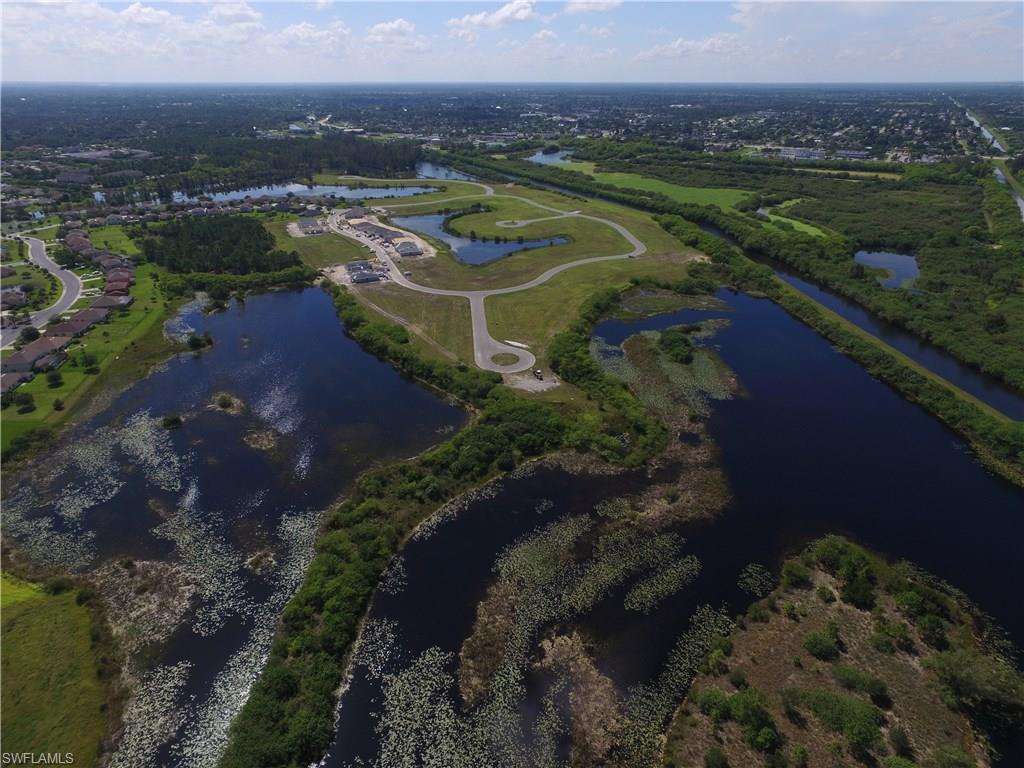8137 Gopher Tortoise Trail Lehigh Acres, FL 33972 - Photo 21 of 21 a view of a lake with a yard