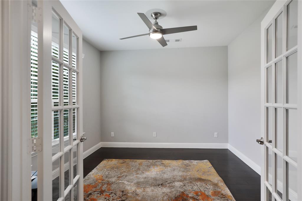 925 Spring Falls Drive McKinney, TX 75071 - Photo 13 of 40 a view of a bedroom with a bed and a window