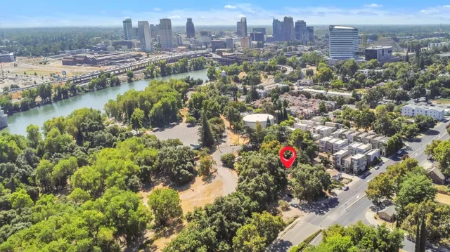 a bedroom with a bed and painting on the wall