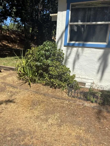 a view of a entryway door with lamp