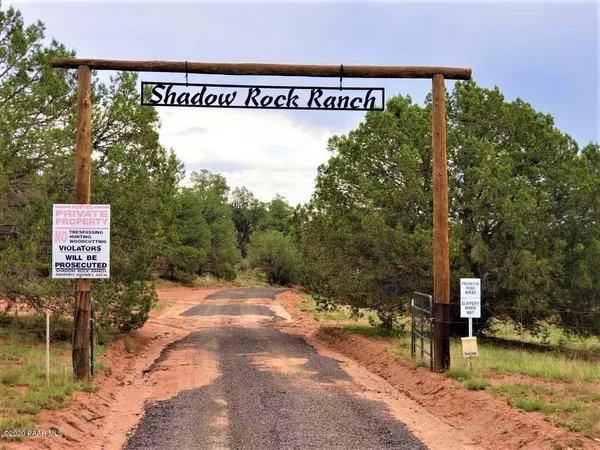 a view of a street with benches in the background