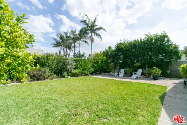 a view of a swimming pool with a yard