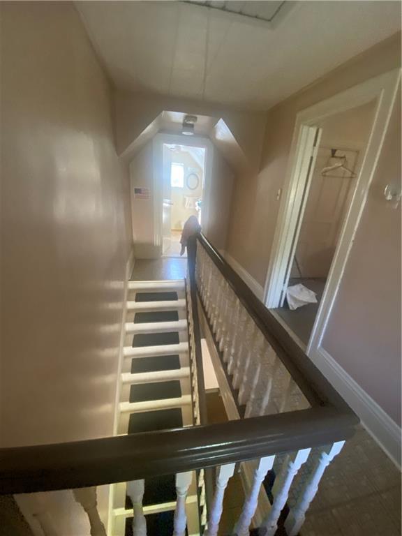 403 Bruce Street McKees Rocks, PA 15136 - Photo 17 of 20 a view of staircase with railing and a chandelier