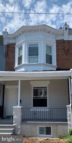a front view of a house with garage