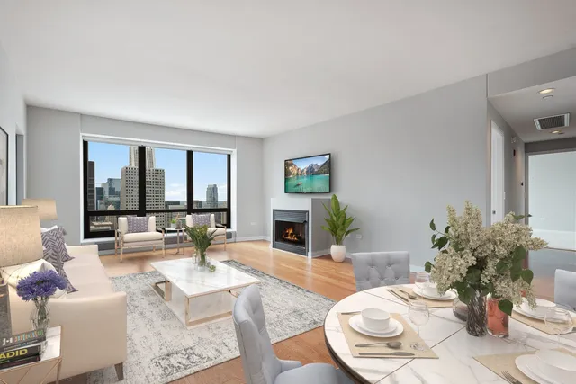 a living room with furniture and a fireplace