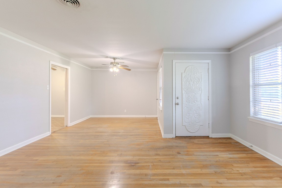 6609 Imogene Street Houston, TX 77074 - Photo 13 of 33 a view of an empty room with wooden floor and a window