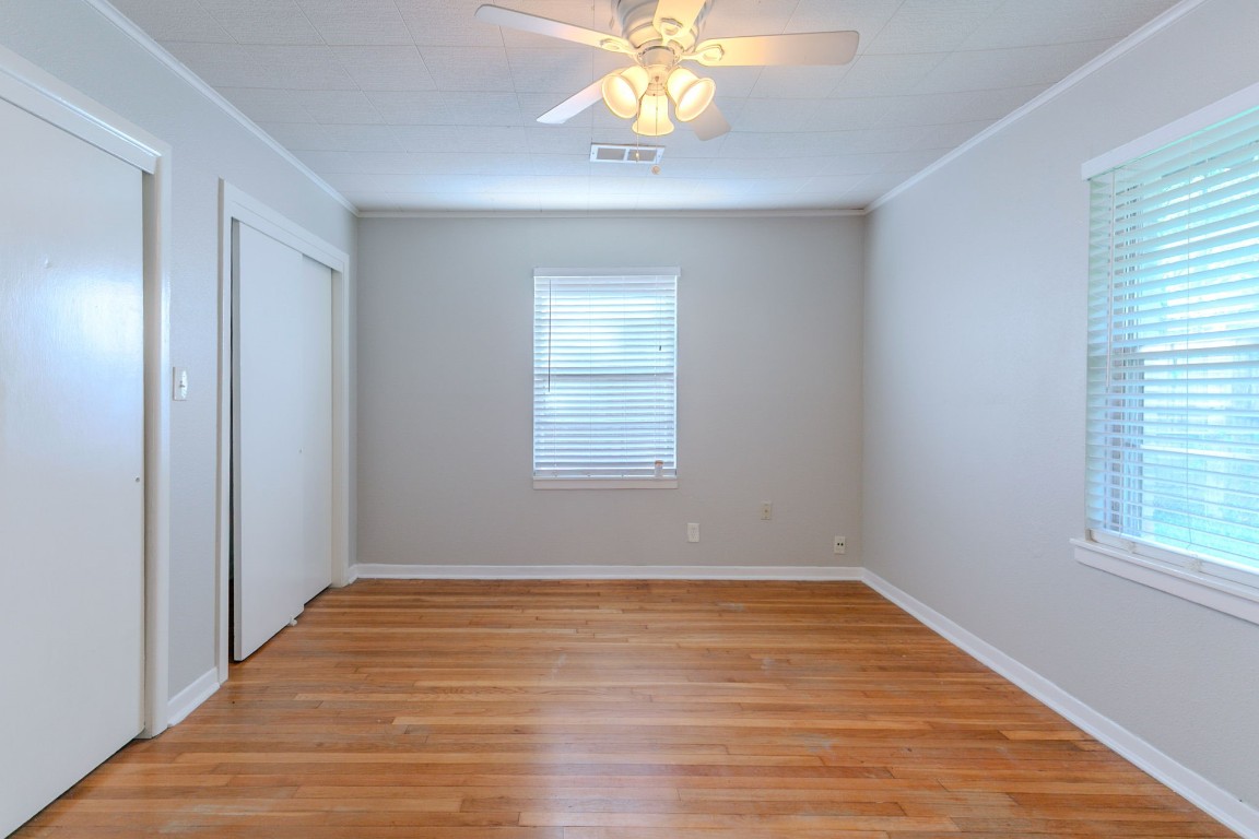 6609 Imogene Street Houston, TX 77074 - Photo 26 of 33 a view of an empty room with window and wooden floor
