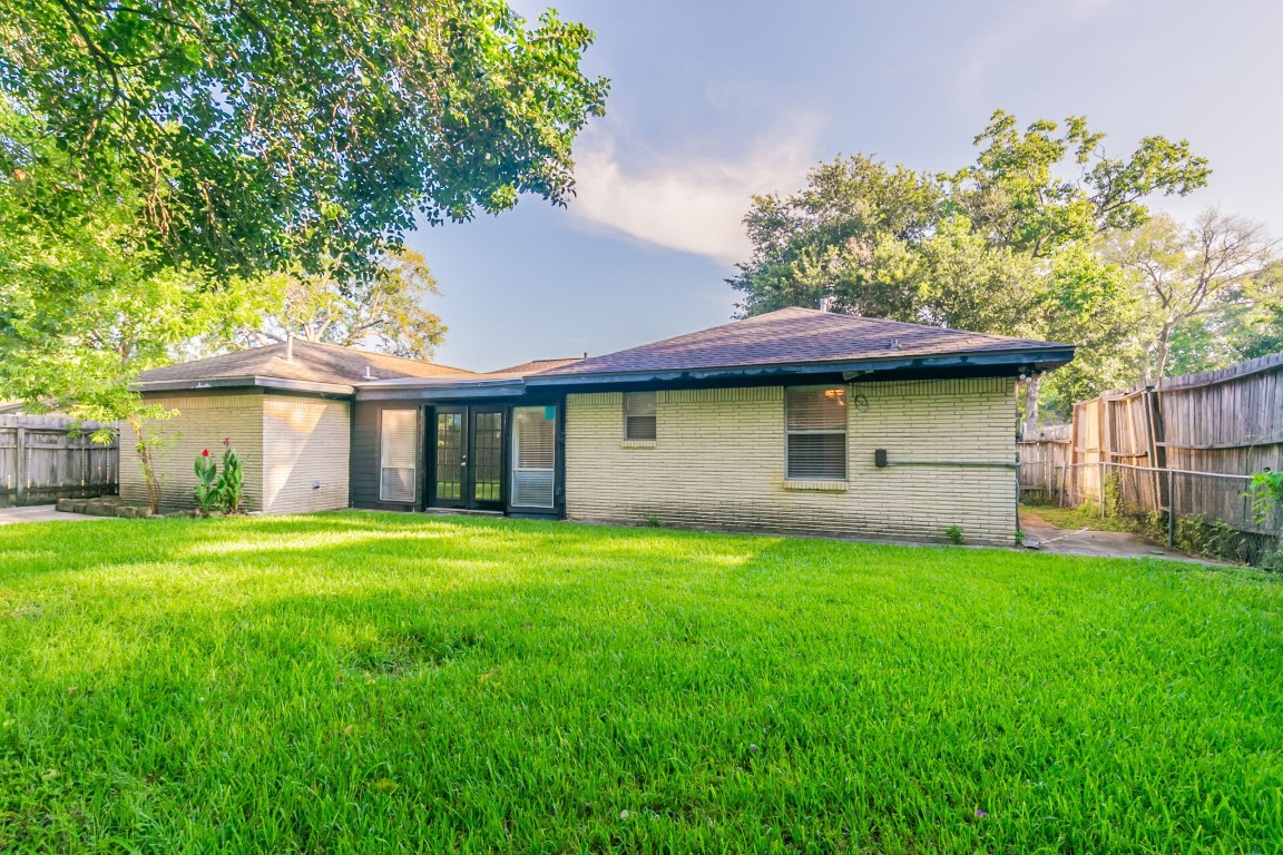6609 Imogene Street Houston, TX 77074 - Photo 29 of 33 a view of a yard in front of a house with a large tree