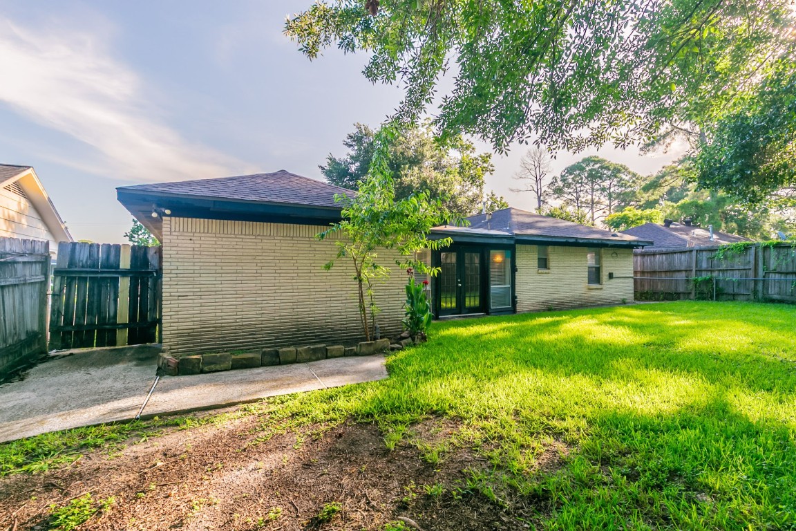 6609 Imogene Street Houston, TX 77074 - Photo 31 of 33 a view of a house with a yard and plants