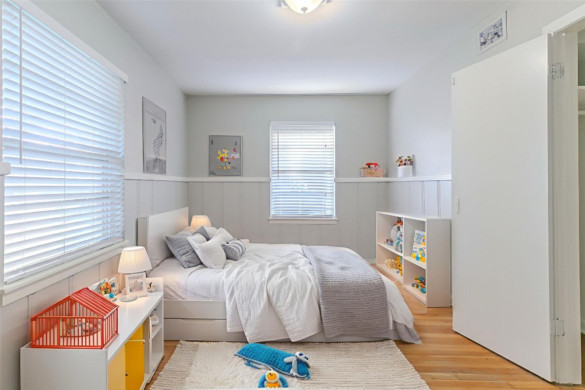 6609 Imogene Street Houston, TX 77074 - Photo 7 of 33 a bedroom with a bed and a window