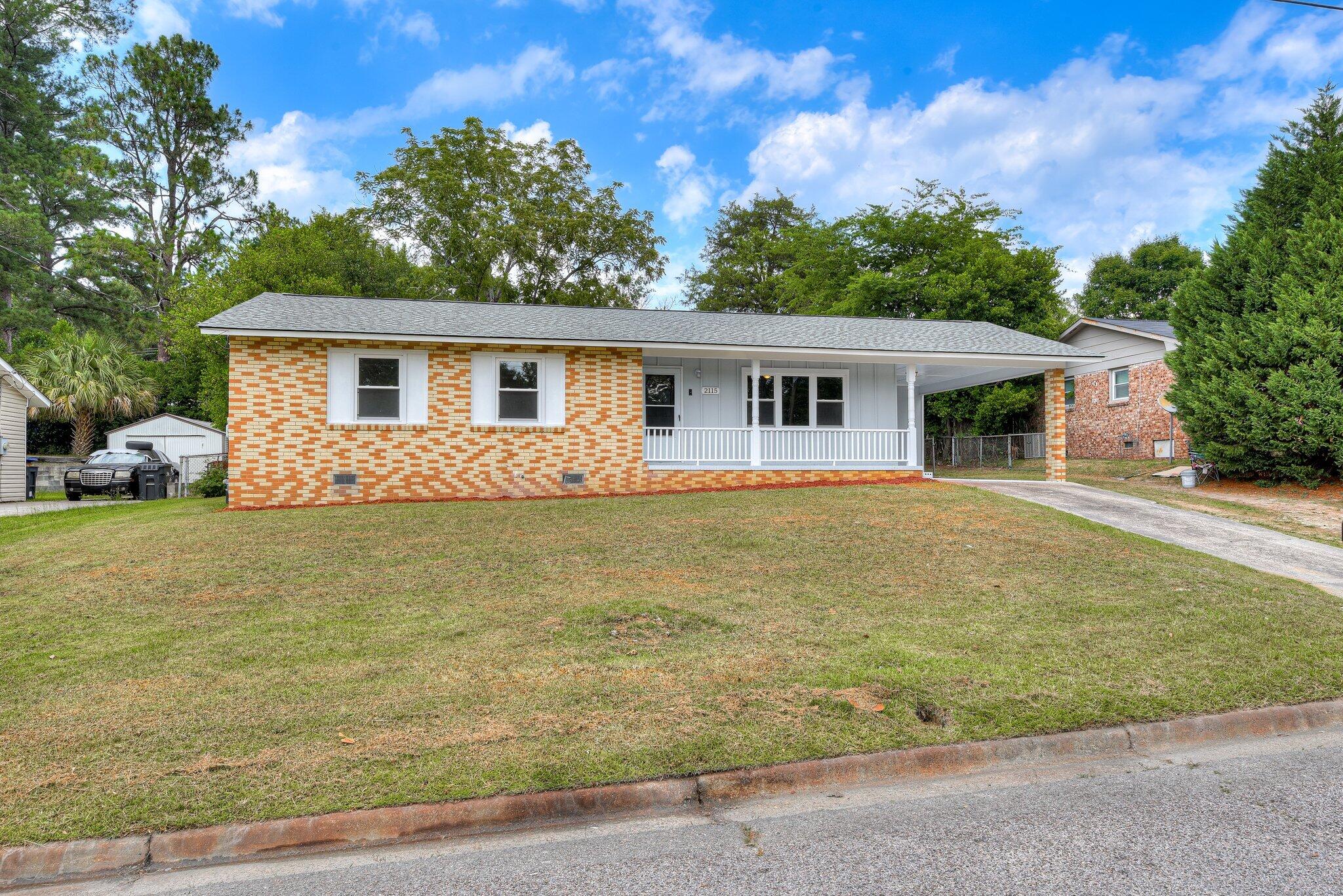 2115 Ashley Drive Augusta, GA 30906 - Photo 2 of 38 a front view of house with yard and trees around