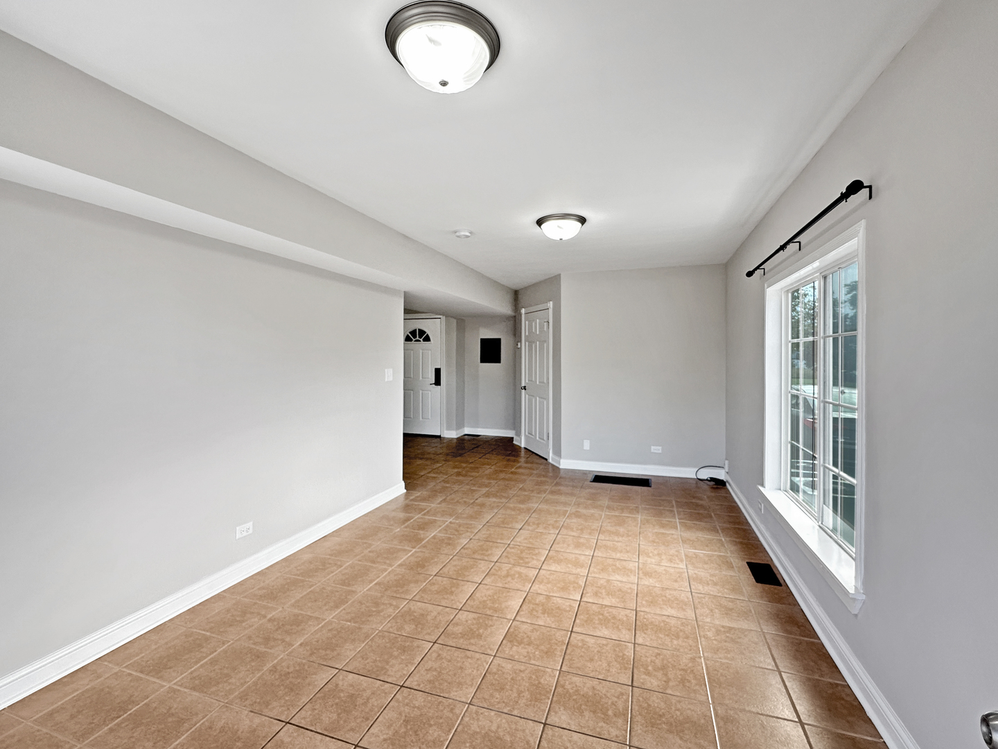 3135 Chicago Road, Unit 1FRONT Steger, IL 60475 - Photo 3 of 13 a view of an empty room with a window