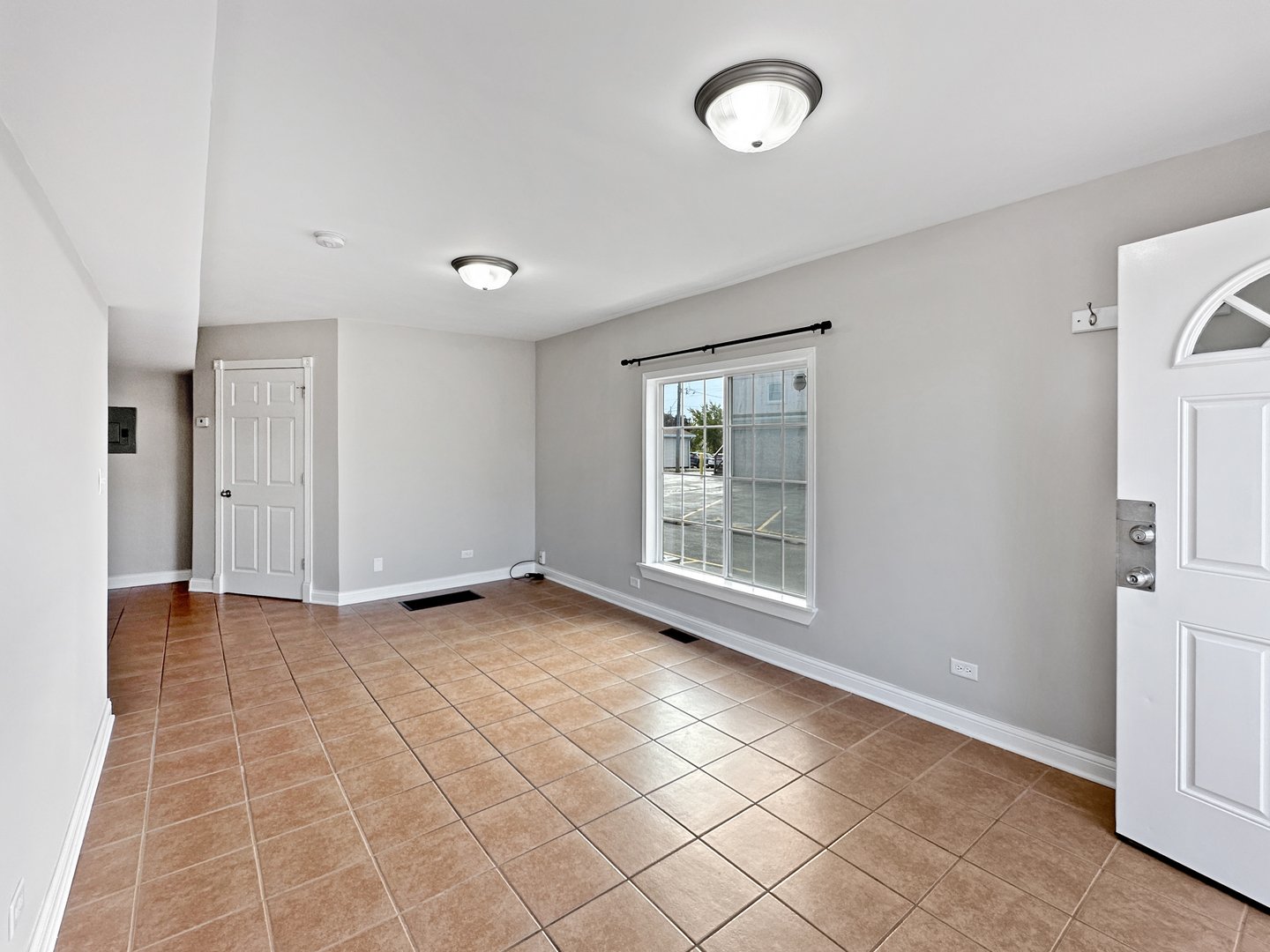 3135 Chicago Road, Unit 1FRONT Steger, IL 60475 - Photo 4 of 13 a view of an empty room with a window