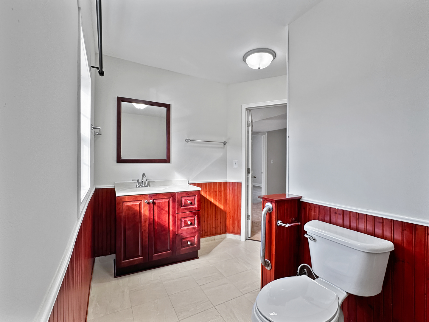 3135 Chicago Road, Unit 1FRONT Steger, IL 60475 - Photo 9 of 13 a bathroom with a toilet sink and mirror