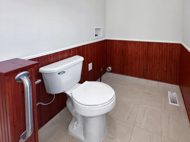 a bathroom with a toilet and a sink