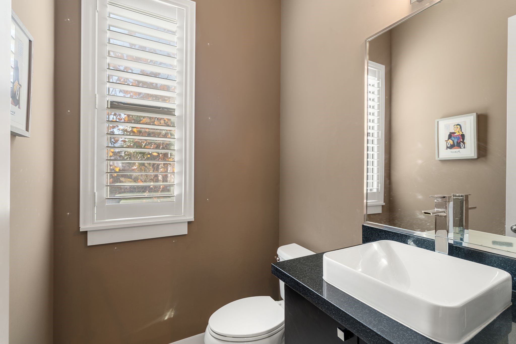 5911 Rose Street Houston, TX 77007 - Photo 11 of 40 A thoughtfully placed powder room offers both convenience and functionality—perfect for guests while maintaining privacy in the main living areas.
