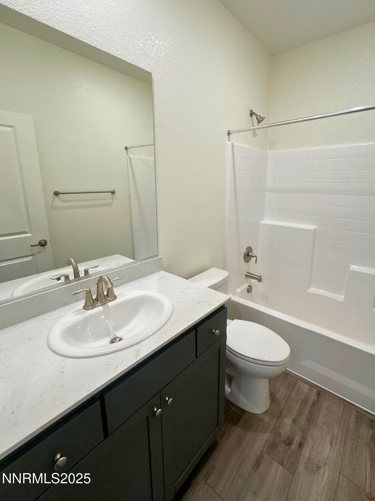 7145 Owl View Drive Sparks, NV 89436 - Photo 12 of 16 a bathroom with a sink and a mirror