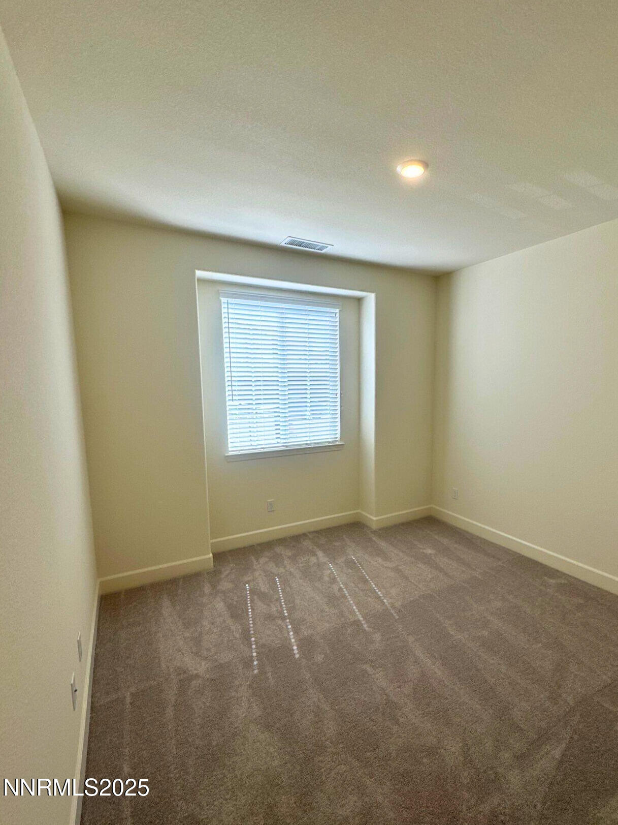 7145 Owl View Drive Sparks, NV 89436 - Photo 13 of 16 an empty room with windows