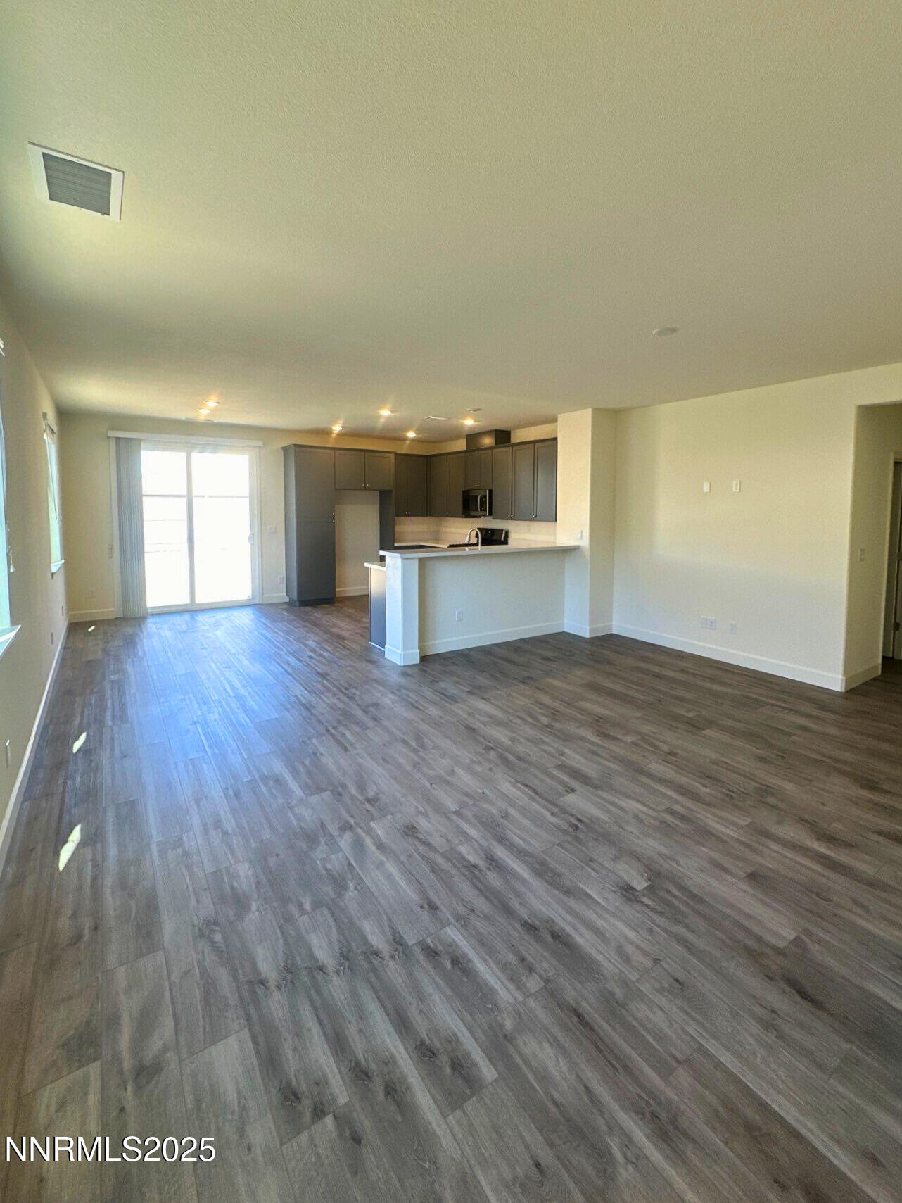 7145 Owl View Drive Sparks, NV 89436 - Photo 2 of 16 a view of a kitchen with wooden floor