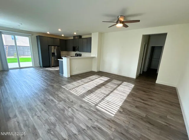 a view of kitchen with cabinets and wooden floor
