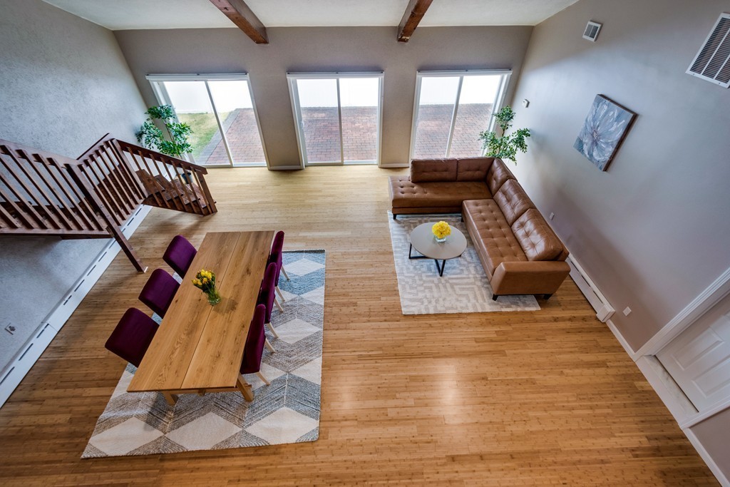 1 Winslow Road Needham, MA 02492 - Photo 15 of 27 a living room with furniture floor to ceiling window and wooden floor