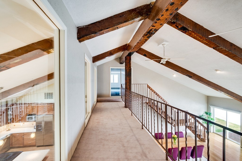 1 Winslow Road Needham, MA 02492 - Photo 17 of 27 a view of a hallway with wooden floor and staircase