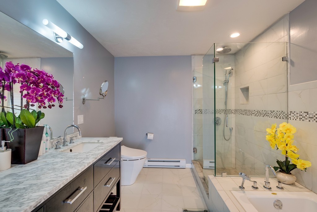 1 Winslow Road Needham, MA 02492 - Photo 20 of 27 a bathroom with a granite countertop sink a large mirror and a shower