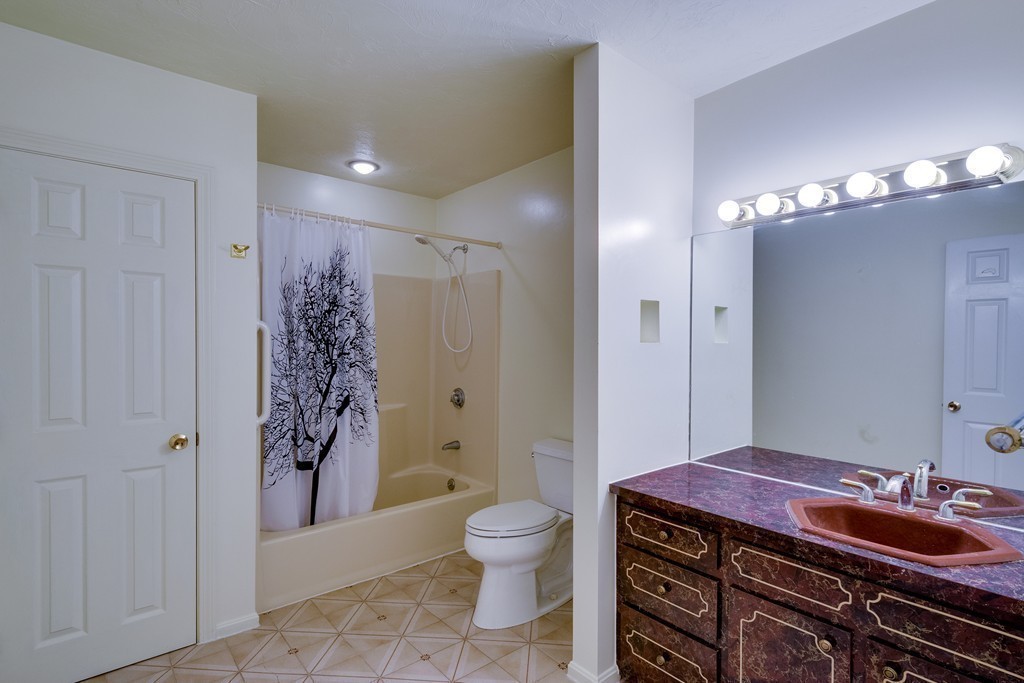 1 Winslow Road Needham, MA 02492 - Photo 23 of 27 a spacious bathroom with a granite countertop sink a toilet a mirror and shower