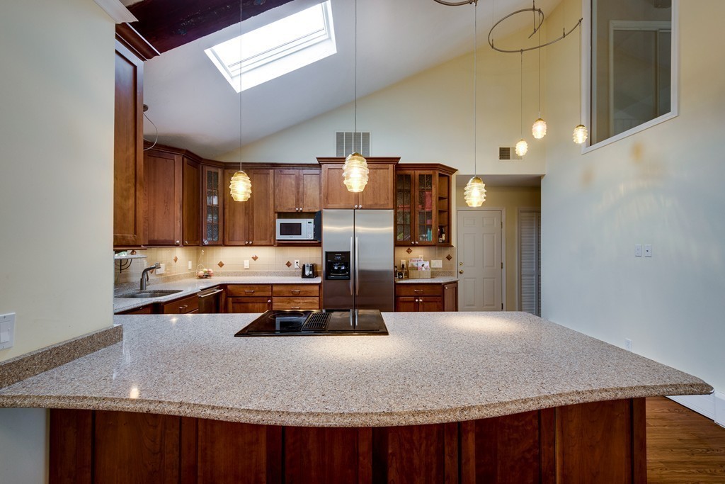 1 Winslow Road Needham, MA 02492 - Photo 5 of 27 a kitchen with stainless steel appliances granite countertop a sink refrigerator and cabinets