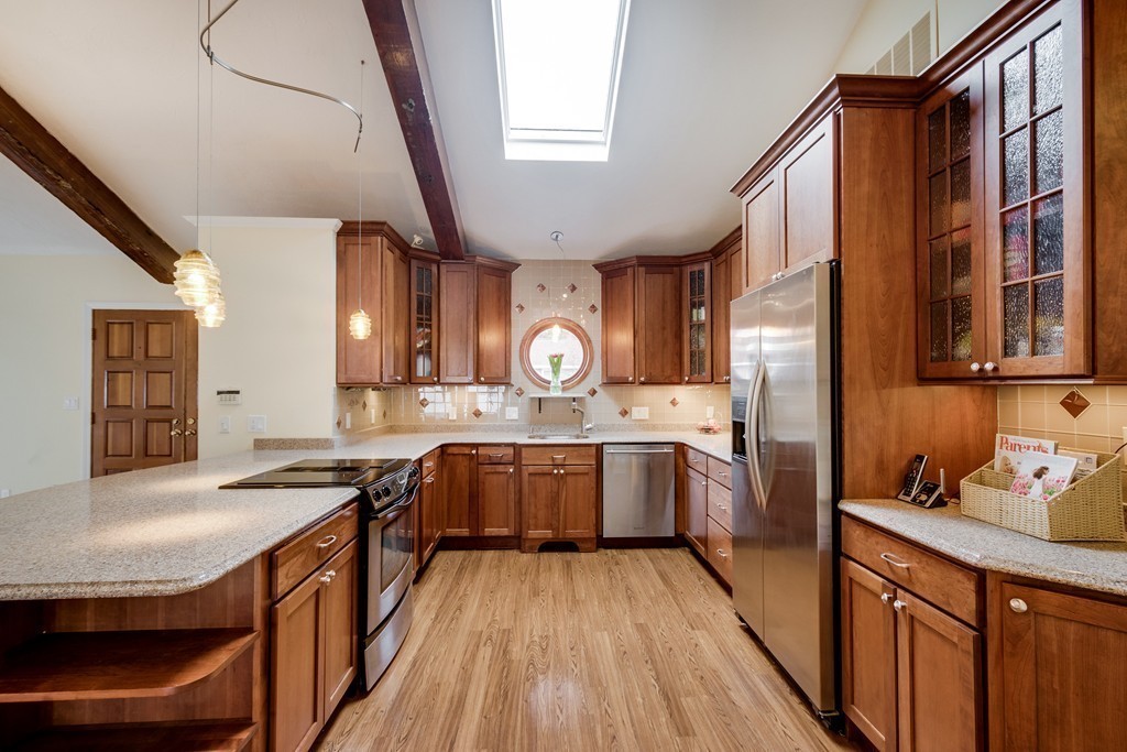 1 Winslow Road Needham, MA 02492 - Photo 6 of 27 a kitchen with granite countertop a sink a stove refrigerator and cabinets