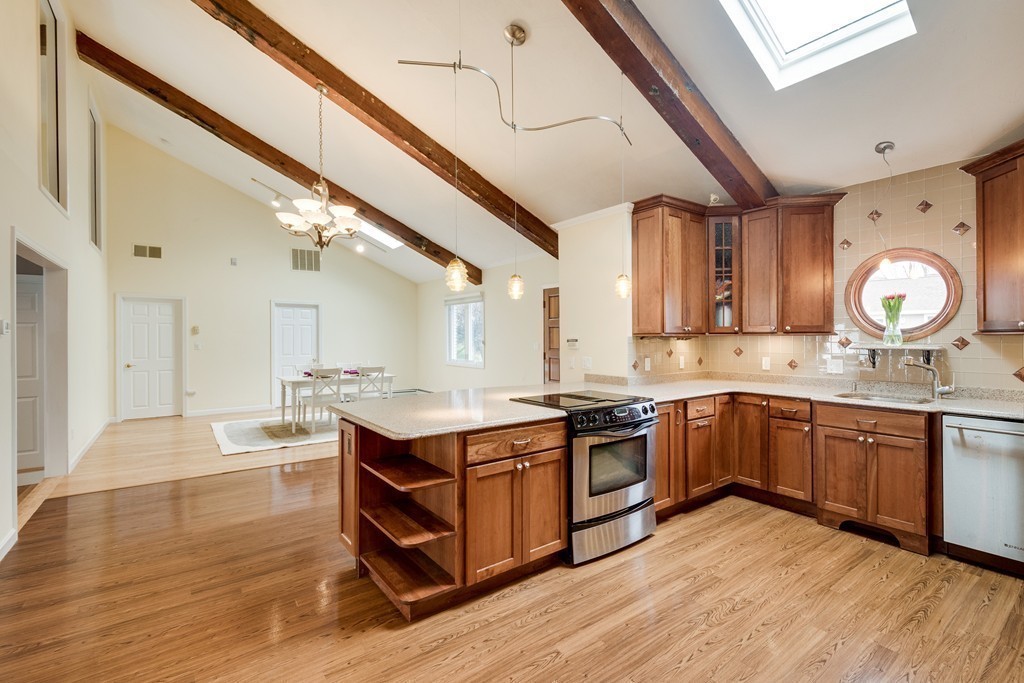 1 Winslow Road Needham, MA 02492 - Photo 8 of 27 a kitchen with stainless steel appliances granite countertop a sink and cabinets