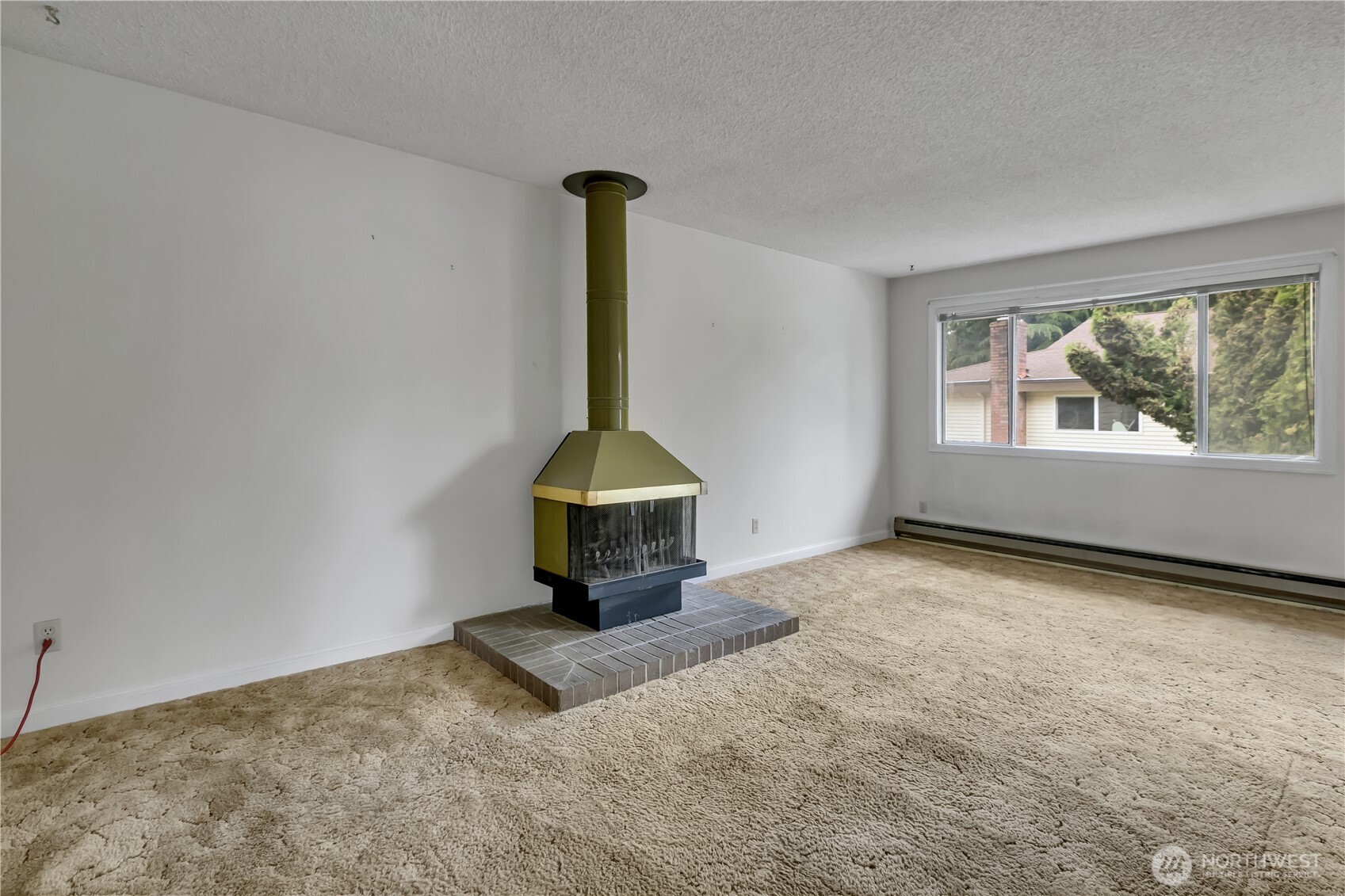 412 213th Place Southwest, Unit 21D Bothell, WA 98021 - Photo 7 of 28 a view of empty room with a fireplace