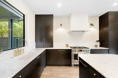 a kitchen with a stove and a refrigerator